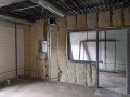 interior insulation being applied to interior walls